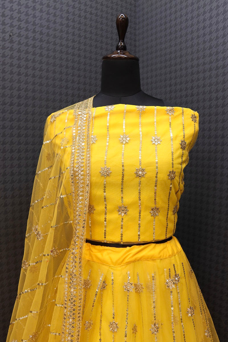 Yellow Coloured Sequence Work Butterfly Net Lehenga Choli