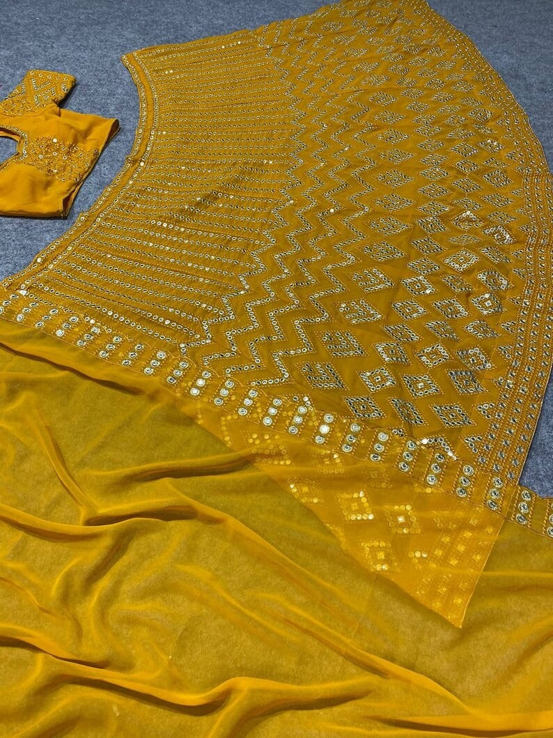 GOLDEN YELLOW EMBROIDERED ATTRACTIVE PARTY WEAR SILK LEHENGA CHOLI HAS A REGULAR-FIT AND IS MADE FROM HIGH-GRADE FABRICS AND YARN