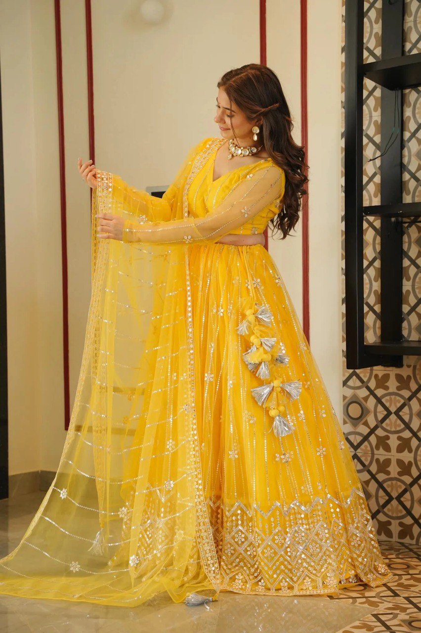 Yellow Coloured Sequence Work Butterfly Net Lehenga Choli