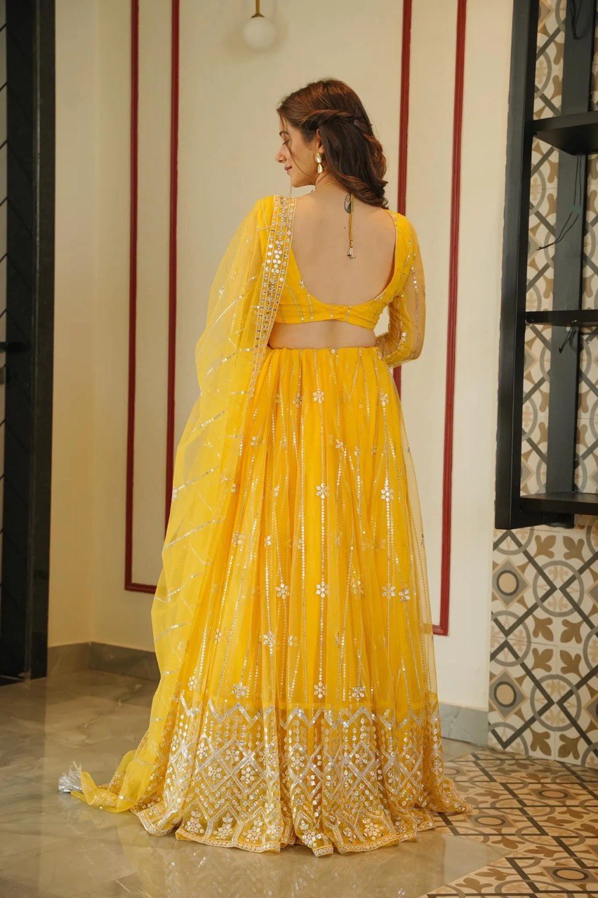 Yellow Coloured Sequence Work Butterfly Net Lehenga Choli