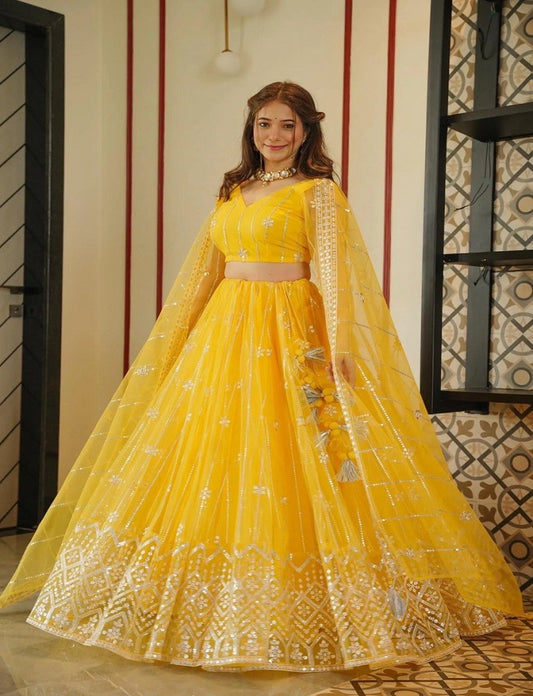 Yellow Coloured Sequence Work Butterfly Net Lehenga Choli